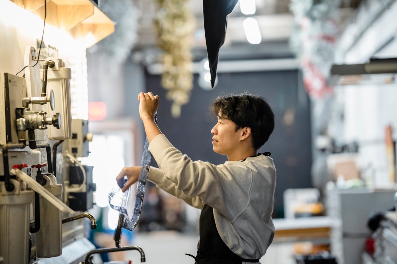 Home Adult processing film in a laboratory setting. Passion for analog photography.